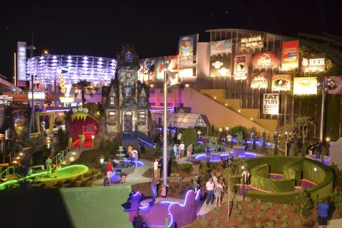 Scene of people playing mini golf at Universal CityWalk.