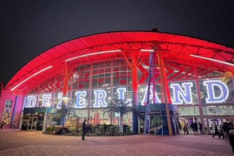 Dezerland exterior lit with neon lights at night