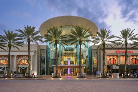 Exterior of Mall at Millenia with palm trees and blue sky