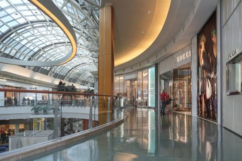 Interior view of Mall at Millenia with bright windows and curving architecture
