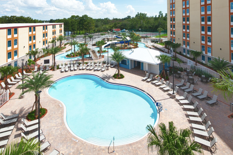 Large outdoor pool surrounded by the Red Lion Hotel rooms.