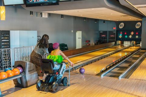 Lolo Spencer uses a bowling assist ramp at Splitsville