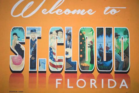 Colorful mural reading “Welcome to St. Cloud, Florida,” featuring illustrations of local culture, history, and natural scenery inside each letter.