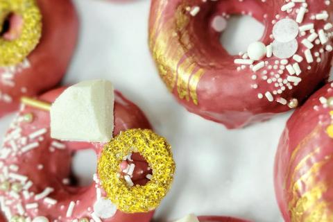 Pink and gold donuts with sprinkles at Savvy Sweets in St. Cloud