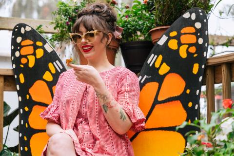 Keiko Lynn meets a butterfly in Lily's Butterfly Garden at Boggy Creek Airboat Adventures.