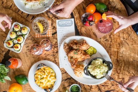 A table of Southern Cuisine at Chef Art Smith's Homecomin' in Disney Springs®.