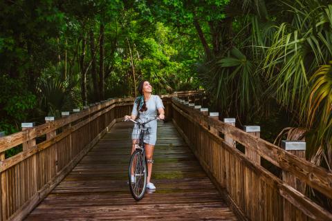 A woman biking in nature