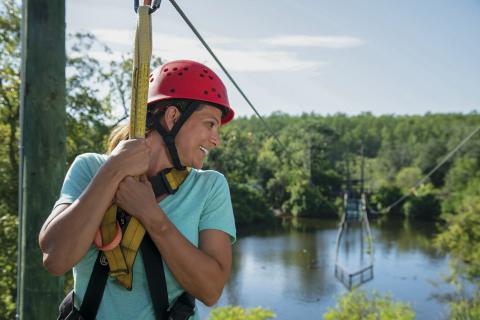 Woman on the Screamin' Gator Zip Line at Gatorland