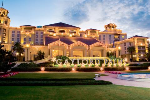 Exterior shot of Gaylord Palms Resort with holiday lights.