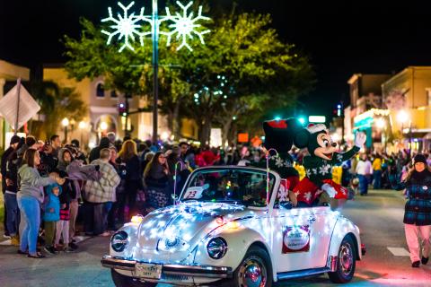 A car drives in the Kissimmee Festival of Lights Parade
