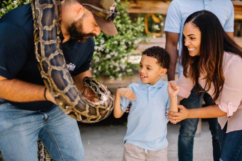 A mother and son meet an animal at Gatorland