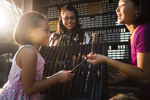 A little girl receives her wand