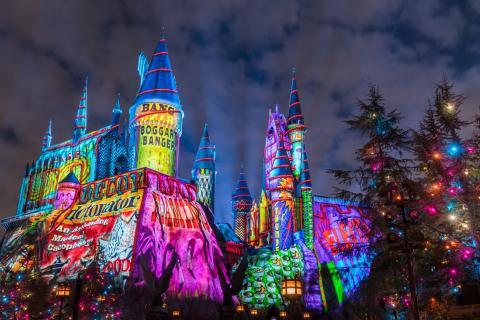 Exterior shot of Hogwarts Castle at Universal Studios decorated in Christmas lights.