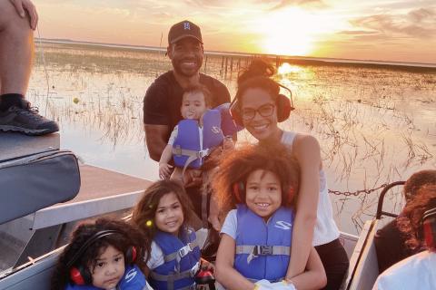 A family with young kids goes on an airboat ride in Kissimmee