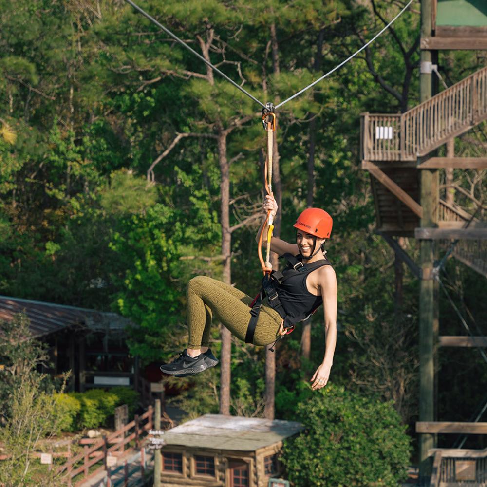 Caitlin Dechelle zip lines at Gatorland