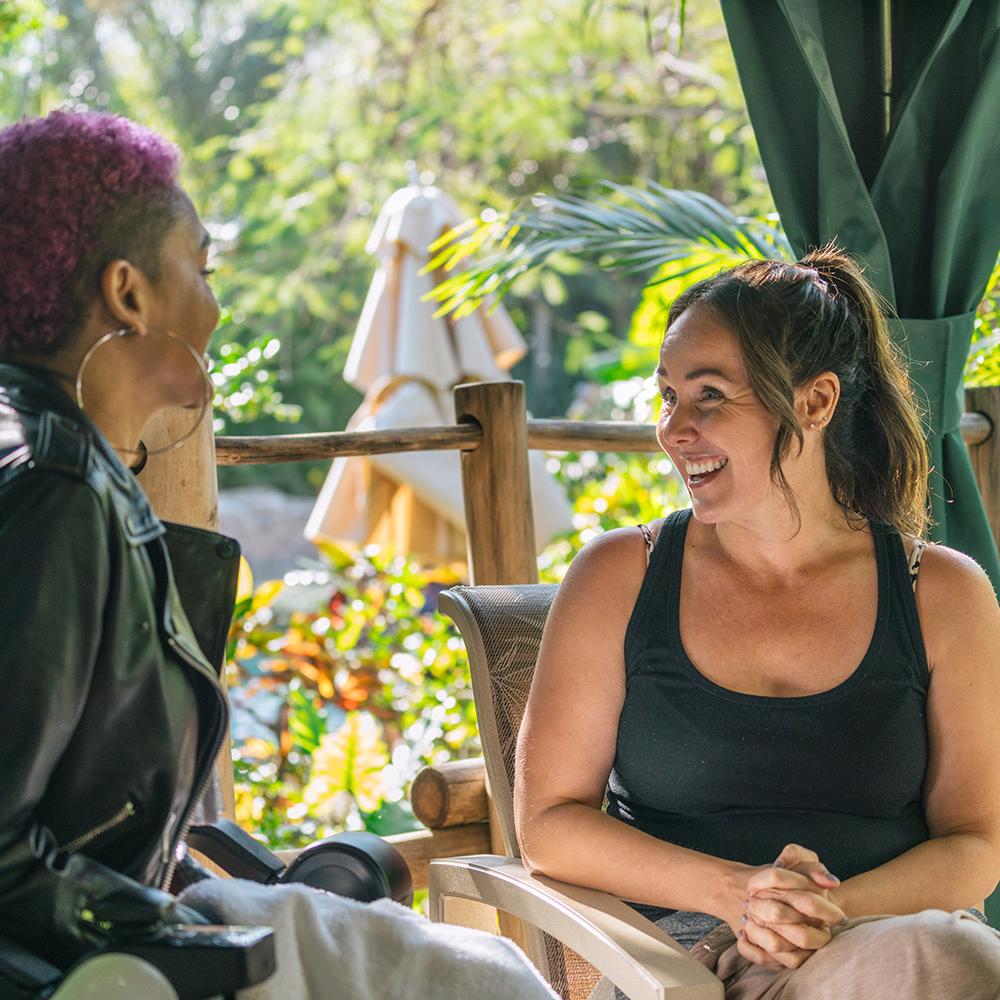 Lolo Spencer and Jen Bonner talk in a cabana at Discovery Cove