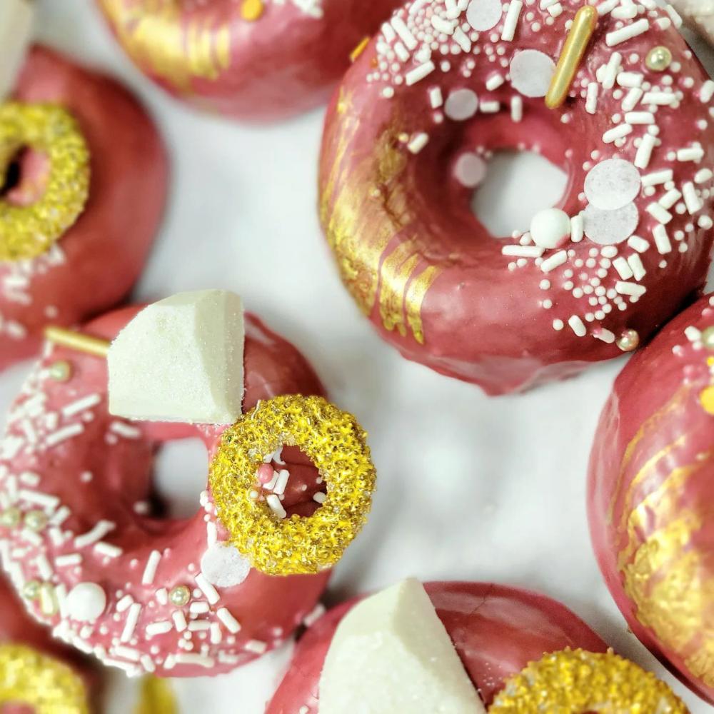 Pink and gold donuts with sprinkles at Savvy Sweets in St. Cloud
