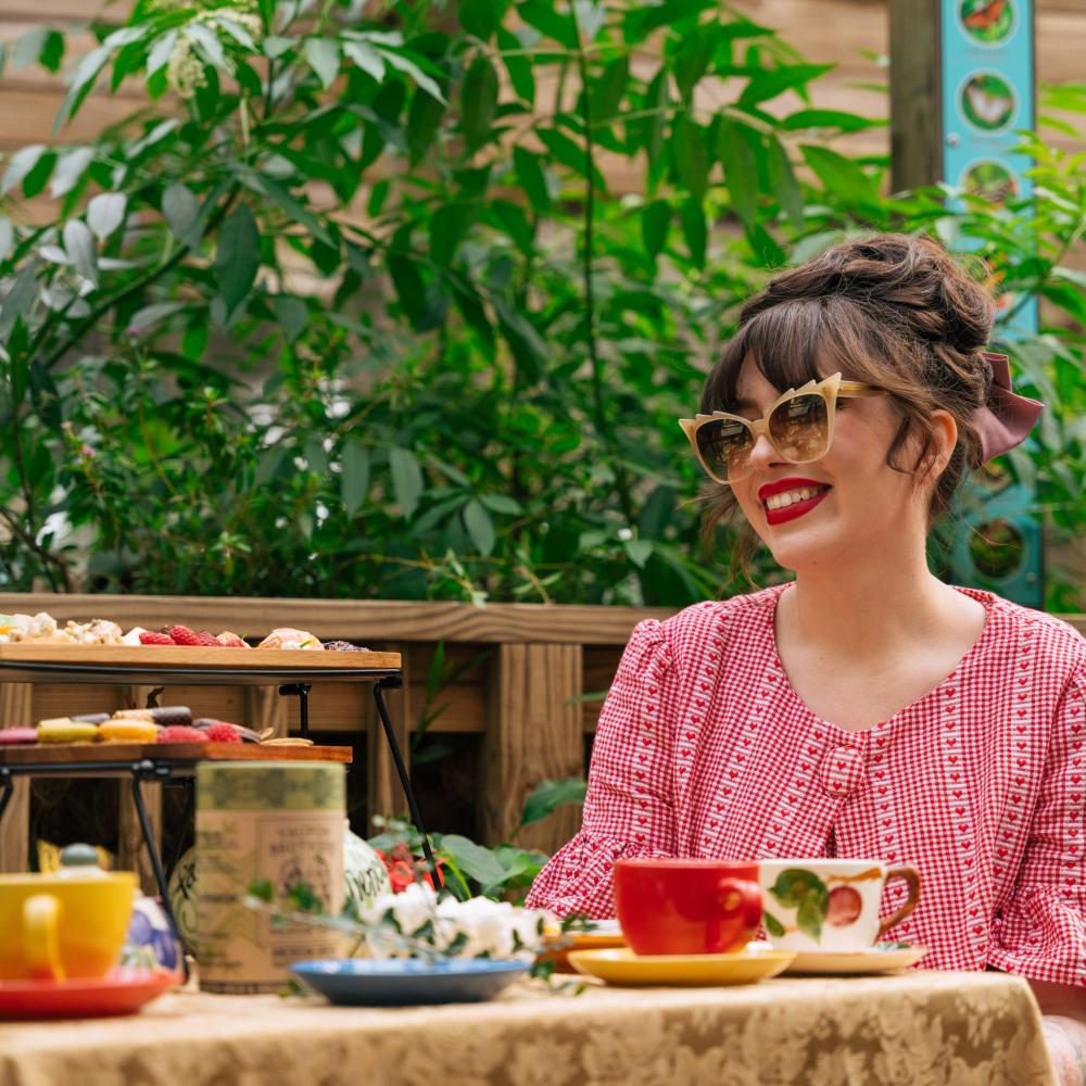 Keiko Lynn enjoys tea time in Lily's Garden at Boggy Creek Airboat Adventures.