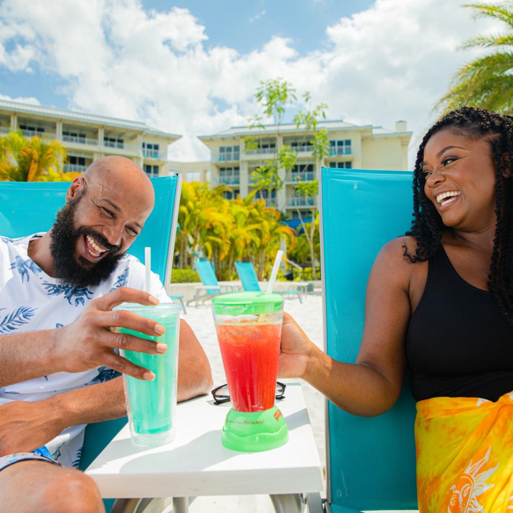 A man and woman toast to their accommodations in Kissimmee  