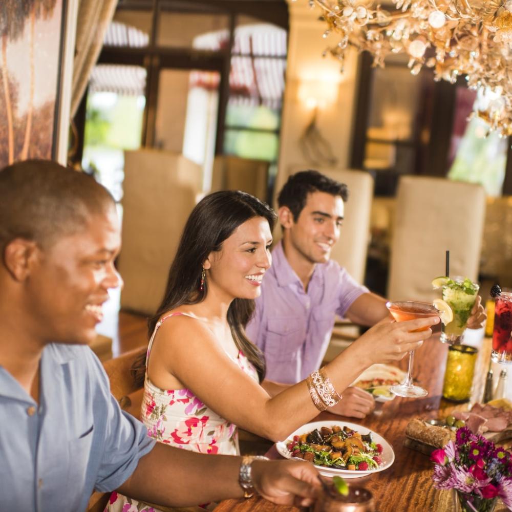 Friends and family toast to a meal in Kissimmee