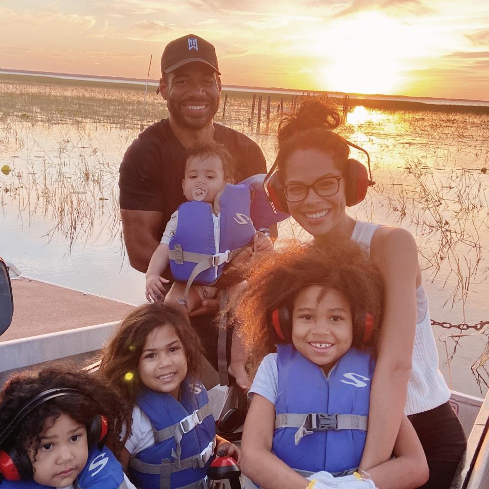 A family with young kids goes on an airboat ride in Kissimmee