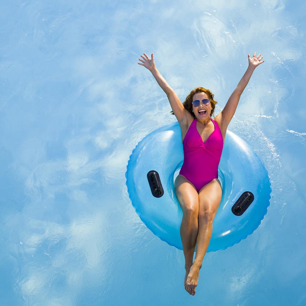 Woman in tube on water