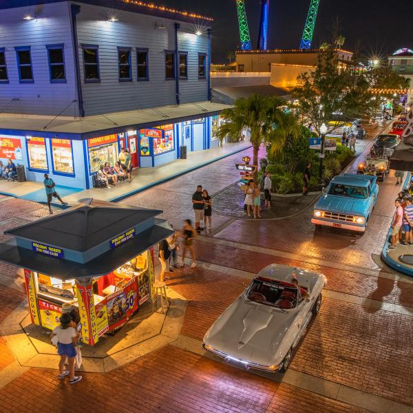 Old Town main street at night with lighted cars and buildings
