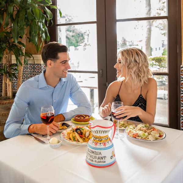 couple smiling at eachother dining at Columbia Resturant