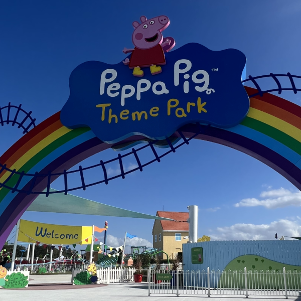 Colorful rainbow entrance arch at Peppa Pig Theme Park in Winter Haven, Florida, located near Kissimmee, welcoming families to an accessible, preschooler-friendly park filled with fun rides and interactive play areas.