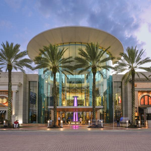 Exterior of Mall at Millenia with palm trees and blue sky