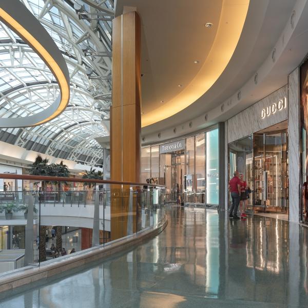 Interior view of Mall at Millenia with bright windows and curving architecture