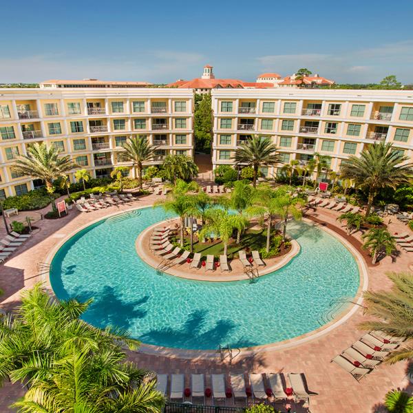 360-degree blue pool surrounded by guest rooms at Melia Orlando Celebration.