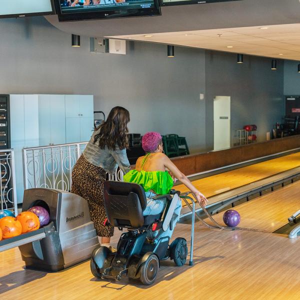 Lolo Spencer uses a bowling assist ramp at Splitsville