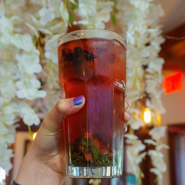 A refreshing wellness tea with fresh herbs and fruit served at Susana's Cafe in downtown Kissimmee.