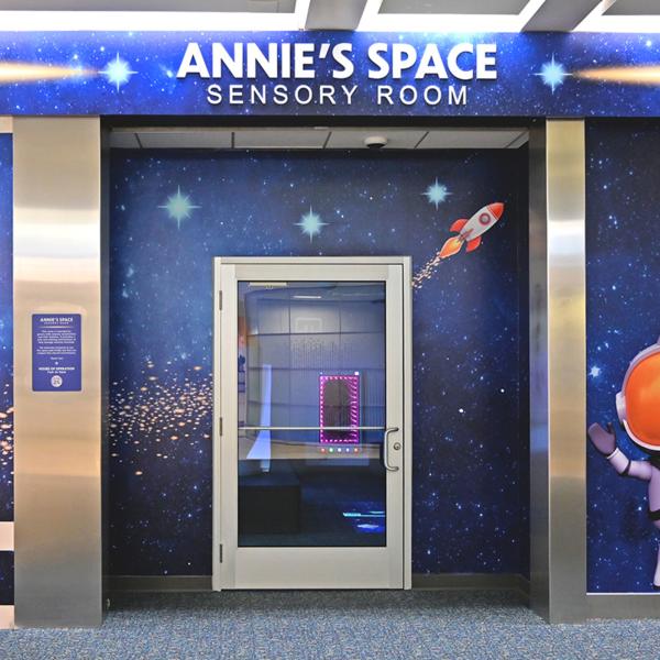 Annie’s Space Sensory Room at Orlando International Airport, designed as a calming, space-themed environment to support travelers with sensory sensitivities near Kissimmee, Florida.
