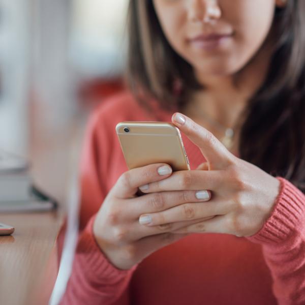 Woman texting on mobile phone