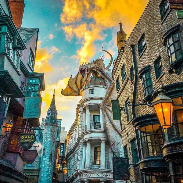 A dragon sits atop Gringott's Bank in Diagon Alley