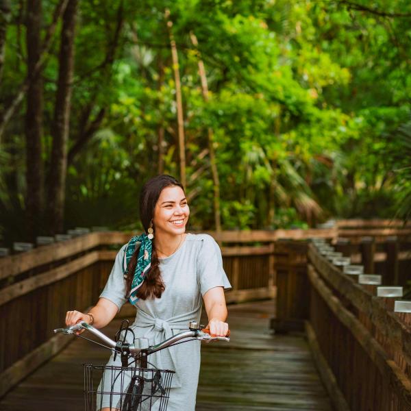 Izzy Rpse rides a bike at Celebration Bike Rental