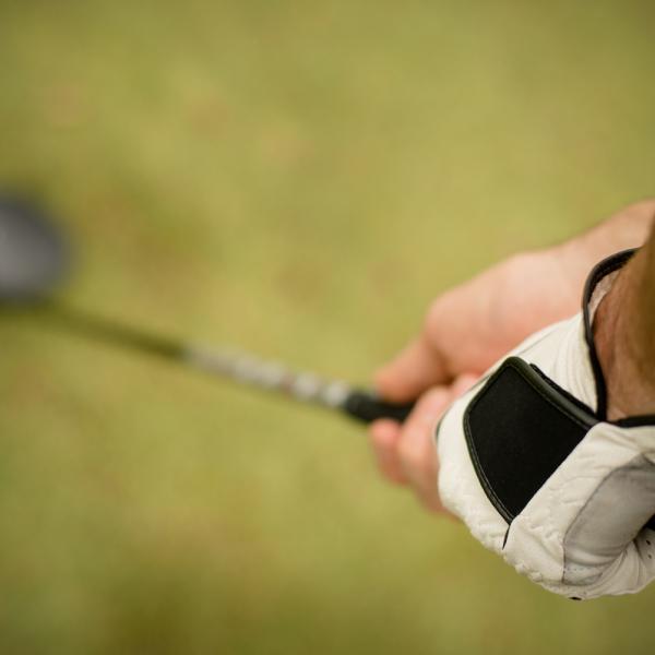 golf club hitting the ball