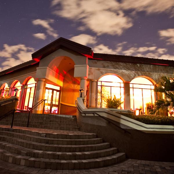 Building with dramatic sunset in background.