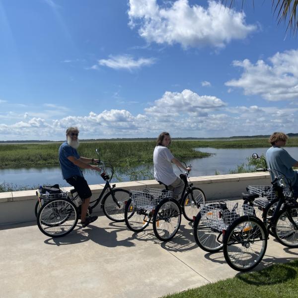 Bicycling fun for the whole family riding along the nature trail at Kissimmee Lakefront Park.